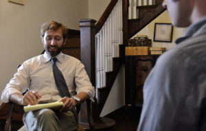 Adam (T.W. Leshner) interviewing Marcus and Thomas