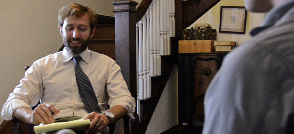 Adam interviewing, Marcus foreground cropped
