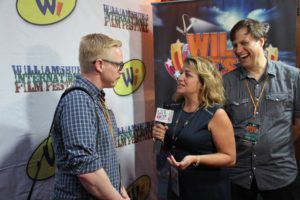 Ben Wise at WilliFest while Julius Galacki laughs at Donna Drakes joke